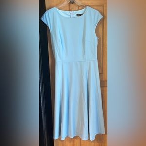 Beautiful summer dress. Never worn. Contains tie to be worn around waist or neck